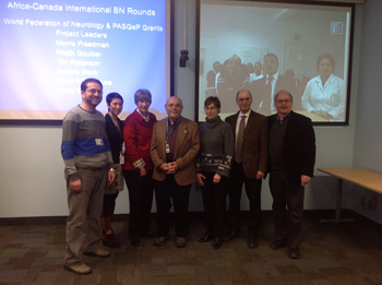 In front of screen in Canada (left to right) Ayman Selim, Carmela Tartaglia, Sandra Black, Arnold Noyek, Cindy Grief, Morris Freedman, Tim  Patterson. On the screen from Tunisia (foreground, left to right) Riadh Gouider, Mouna Ben Djebara and (background) Tunisian participants.