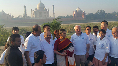 The Taj Mahal plays as backdrop as delegates gather during the Clean India campaign held during the conference.